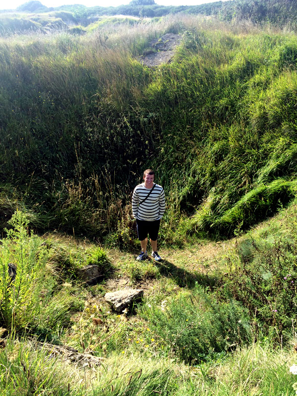 kassel-pairs-cale-standing-in-normandy-bomb-crater