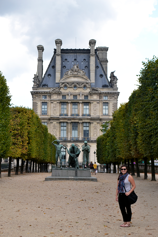 Katie Kassel standing outside of Louvre Museum in Paris, France